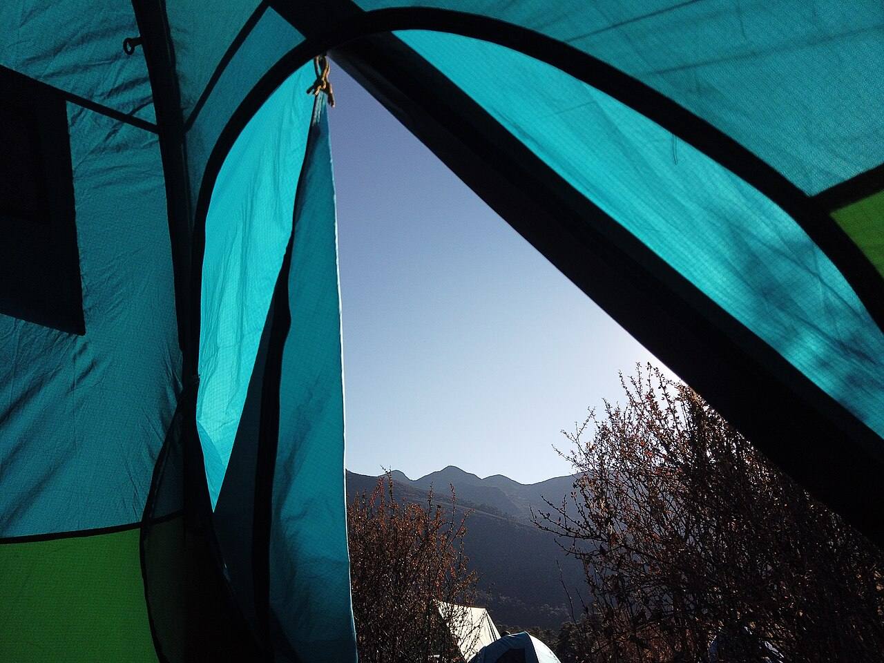 View of mountains from inside a tent